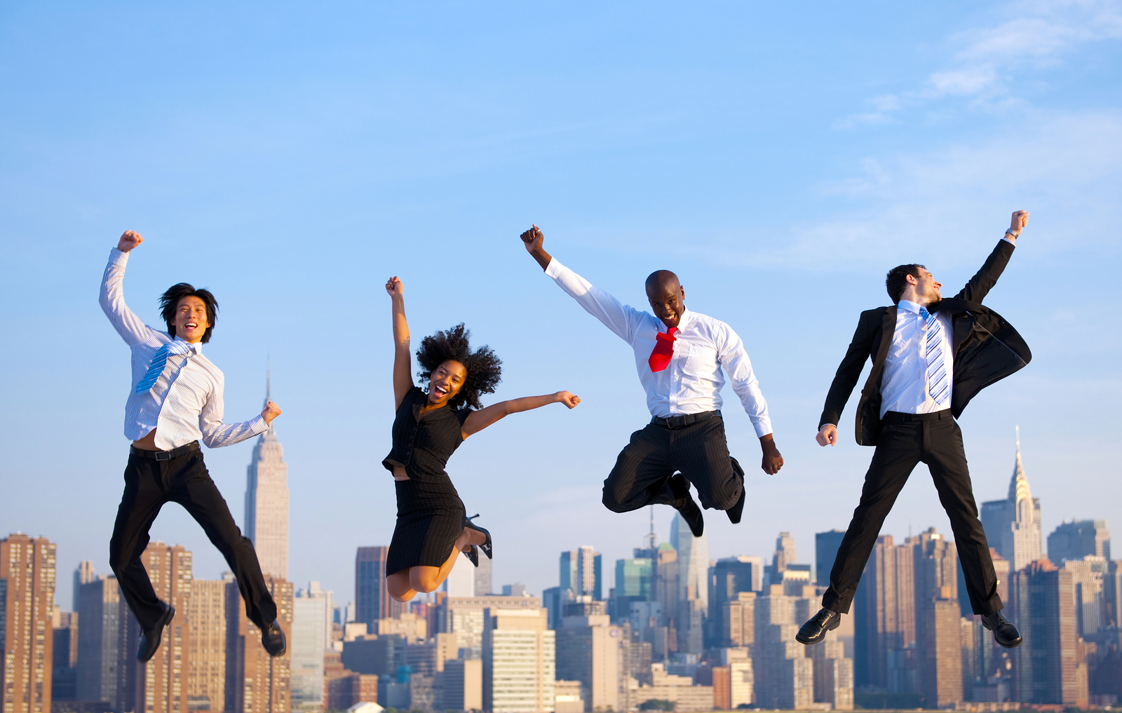 Happy Successful Business People Celebrating and Jumping in New