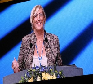 Single Mom, Maryellen Duchesne on stage speaking for audience of over 25,000. The more people you help in network marketing achieve their goals you can achieve your goals.